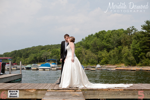 Bride and Groom on the dock at Ehrhardt Resort