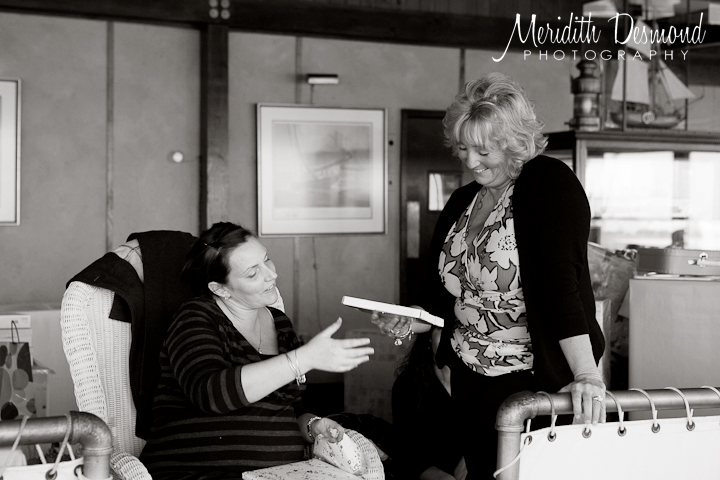 Laughing over books at baby shower