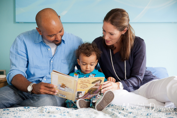 Family reading in bed photo