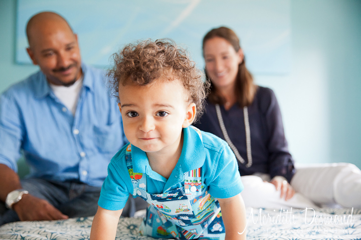 Boy crawling on bed